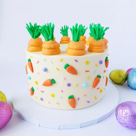 Easter themed cake with carrot decorations and sprinkles